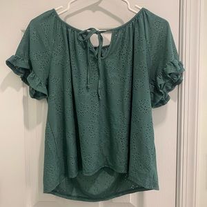 Green ruffled blouse